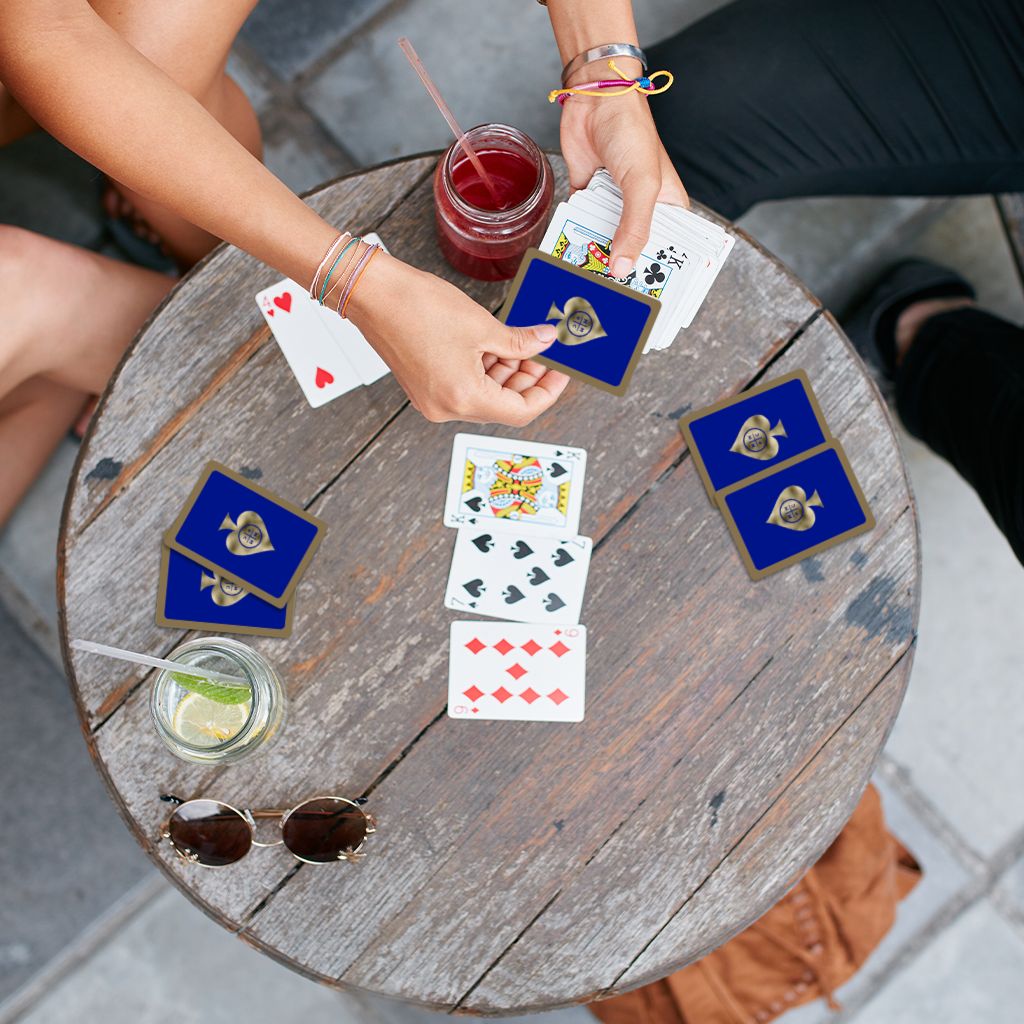 Executive Playing Cards foil stamped, shown in use at a party